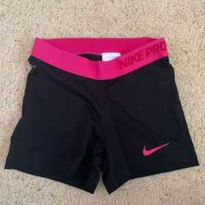 Black and pink Nike Pro shorts